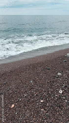 Vertical Screen: sandy beach in winter time . Shot for Social Media