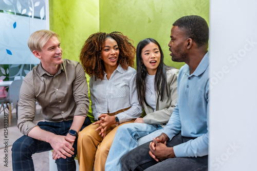 Bilde på lerret Diverse colleagues engaging in collaborative discussion in coworking space