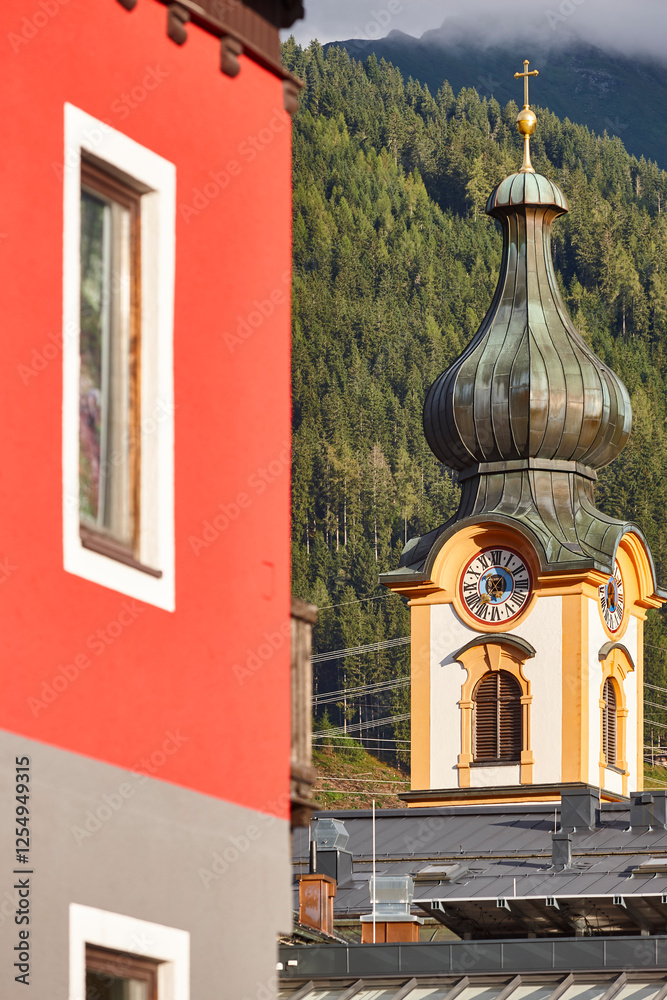 Traditional clock tower church with bulb shaped in Austria, Europe
