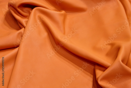 Obraz na płótnie Natural piece of leather in orange color. Textured background w salonie