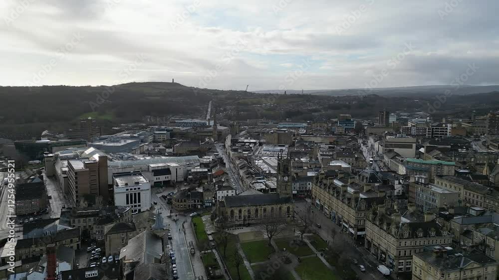 St Peter's Church and its gardens, revealing Huddersfield Town Centre with mountainous background St Peter's Church and its gardens, revealing Huddersfield Town Centre with mountainous background