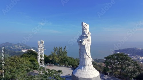 Drone landscape view of the A-Ma Goddess Statue with greenery around on top of Coloane Alto hill photo