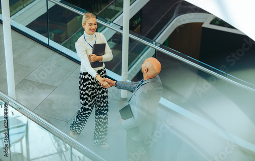 Professional business greeting in a modern corporate environment