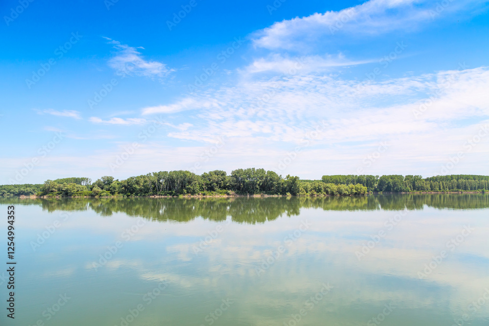 Fototapeta premium Reflection of trees and sky in the lake