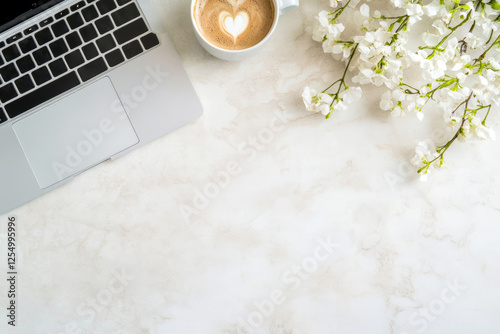 Modern workspace with a coffee cup and laptop on a desk.