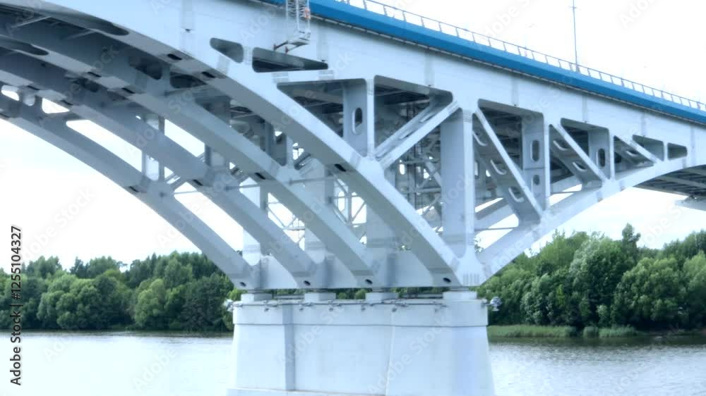 4k video, ship passing under bridge, view from the deck of a river cruise ship of a reinforced concrete bridge over a river with car traffic 4k video, ship passing under bridge, view from the deck of a river cruise ship of a reinforced concrete bridge over a river with car traffic