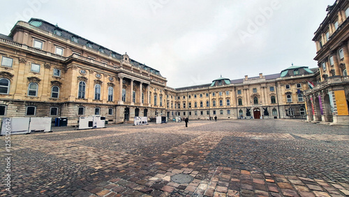 Buda Castle (Budavári Palota) or Royal Palace with the façade of the cour d'honneur on the left and the National Széchényi Library on the right. Castle Hill, Castle Quarter, Budapest, Hungary, Europe.