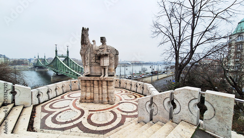 Stone statue of King Saint Steven outside the Gellert Hill Cave in front of the Liberty Bridge. Gellert Hill, Budapest, Hungary, Europe.