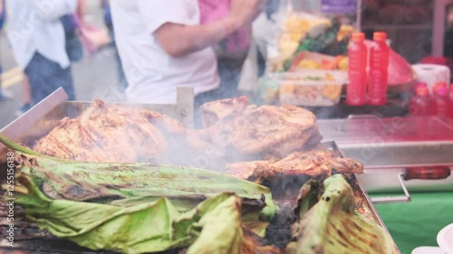 Fish wrapped in banana leaf, grilled chicken, typical street food from the Peruvian jungle