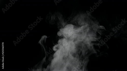 White natural rising steam from food or hot drink isolated on a black background. Сan be used in any projects with hot food. Slow motion.