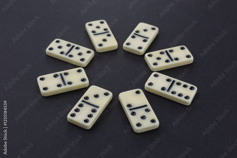 Flat lay composition of chess pieces and dominoes on dark table Flat lay composition of chess pieces and dominoes on dark table