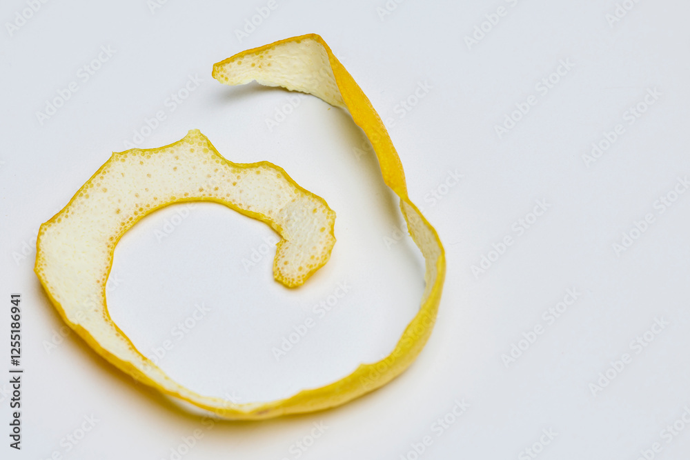 Lemon peel on a white table laid out to dry Lemon peel on a white table laid out to dry
