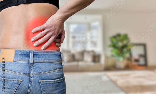 Kidney carcinoma : Agonizing Kidney Pain, Young woman Clutching His Lower Back in Nature, Close-Up Rear View, Medical Concept for Renal Distress. Kidneys pain.
