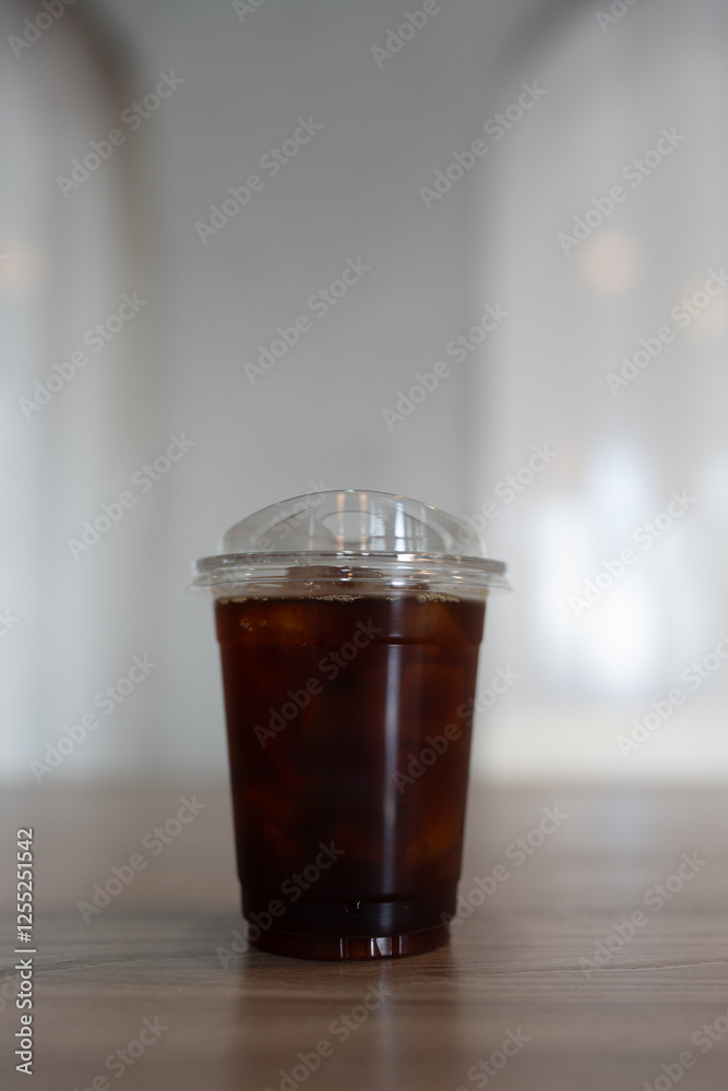 Iced americano coffee on wood table