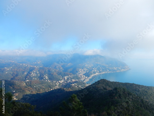 looking down at Moneglia from the trail on top of Comunaglia mount, Liguria, Italy