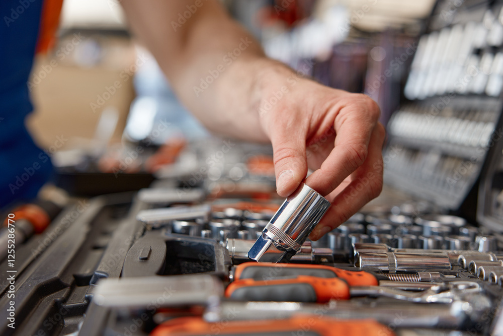 Foreman checking socket wrenches in tool box at hardware store Foreman checking socket wrenches in tool box at hardware store