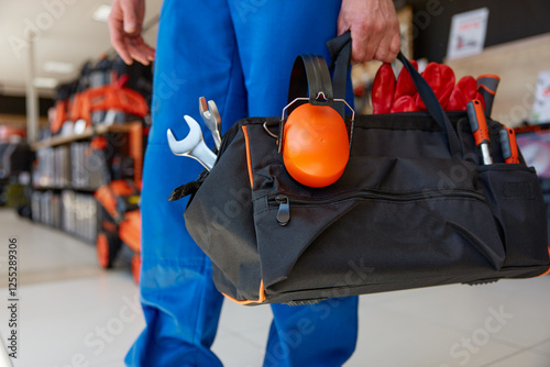 Cropped shot of ergonomic bag for work tools and personal protective equipment
