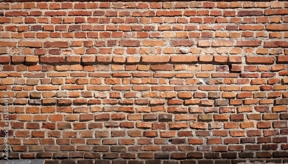 Naklejka premium Exposed brick wall 