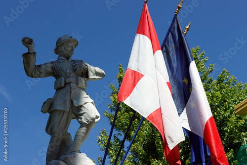 Celebration of July 14, the French national day. War memorials and flags. Saint Gervais. France. photo