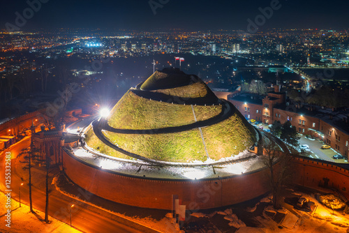 The hill in Krakow with the Kosciuszko Mound illuminated at night. Poland photo