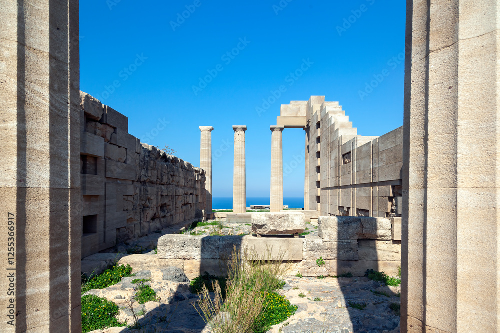 The hellenistic temple of Athena Lindia in ancient Lindos, in Rhodes island, Greece, Europe, a stone Doric temple built around 300 BC from calcareous sandstone upon an older archaic temple