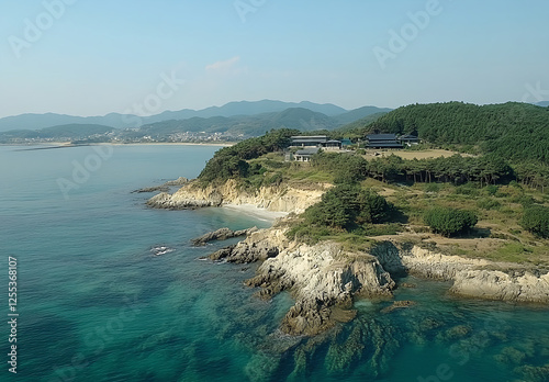 Wallpaper Mural Aerial view of the coast and islands near ลshima in Japan, featuring rugged cliffs and pristine beaches. The ocean is turquoise with gentle waves breaking on rocky shores surrounded by lush  Torontodigital.ca