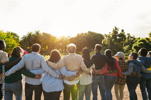 Group of multi generational people hugging each others - Support, multiracial, empowering and diversity concept - Main focus on senior man with white hairs