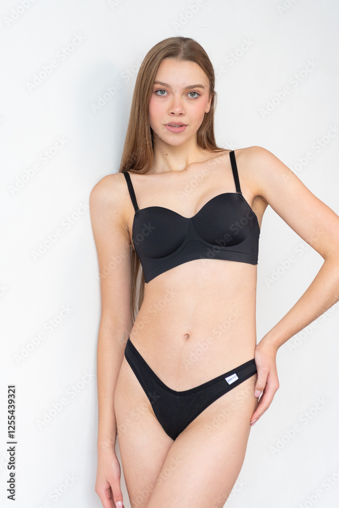 Casting snapshot of a fresh-faced model in simple black underwear, highlighting her natural features, body proportions, and confident stance. Ideal for agency scouting and professional portfolio updat Casting snapshot of a fresh-faced model in simple black underwear, highlighting her natural features, body proportions, and confident stance. Ideal for agency scouting and professional portfolio updat