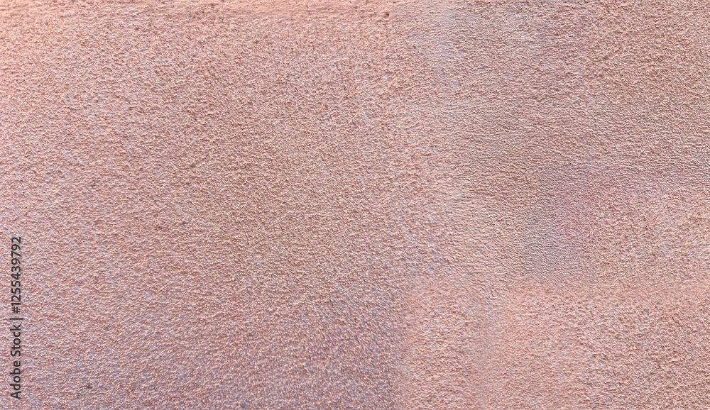 Fototapeta premium Rough Textured Plaster Wall Surface with Subtle Pinkish Beige Tones for Grunge and Vintage Backgrounds