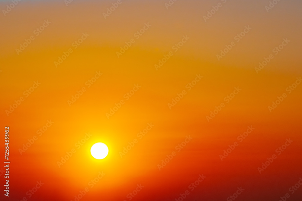 A stunning sunset with a glowing sun casting warm hues of orange, red, and yellow across the sky. The soft gradient creates a peaceful and serene atmosphere. A stunning sunset with a glowing sun casting warm hues of orange, red, and yellow across the sky. The soft gradient creates a peaceful and serene atmosphere.