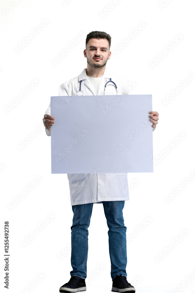 Doctor, full-length, on a white background, showing a white sheet Doctor, full-length, on a white background, showing a white sheet