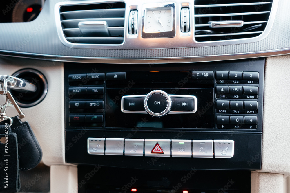 Fototapeta premium Modern interior of a business class car, white perforated leather, aluminum, black varnish, leather steering wheel.