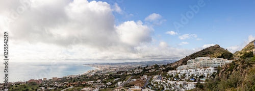 Cuadro en lienzo Wide panorama of white washed Mediterranean coastline town on the Costa del Sol