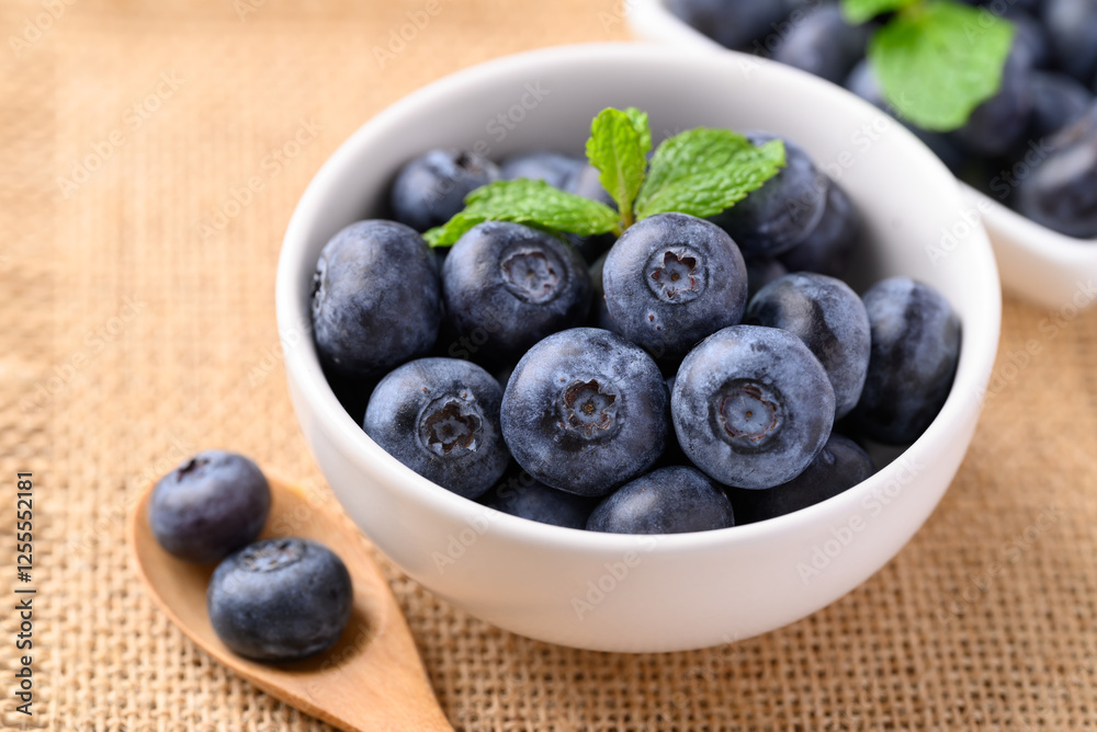 Blueberries in white bowl with spoon, Healthy fruit, Food ingredient Blueberries in white bowl with spoon, Healthy fruit, Food ingredient