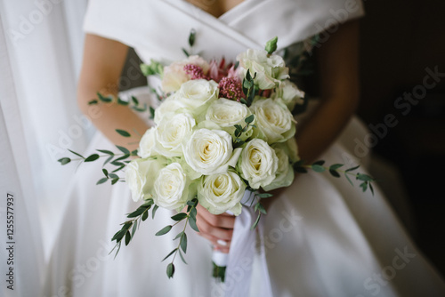 Excited bride in wedding with bouquet.
