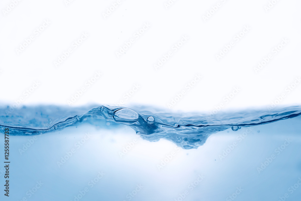Closeup view of dynamic flowing blue water waves on white background. Liquid splash. Texture and abstract background Closeup view of dynamic flowing blue water waves on white background. Liquid splash. Texture and abstract background