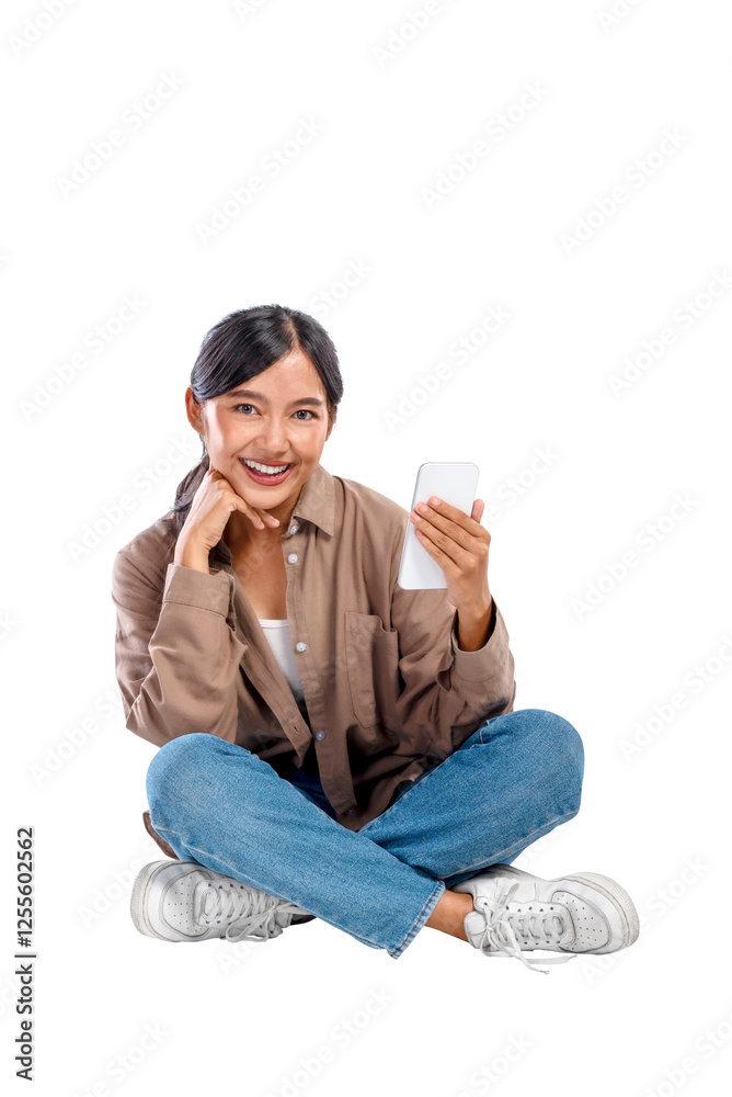 Portrait of an Asian Indonesian Woman in a shirt with a happy expression holding a mobile phone isolated over a white background. Concept of technology Portrait of an Asian Indonesian Woman in a shirt with a happy expression holding a mobile phone isolated over a white background. Concept of technology