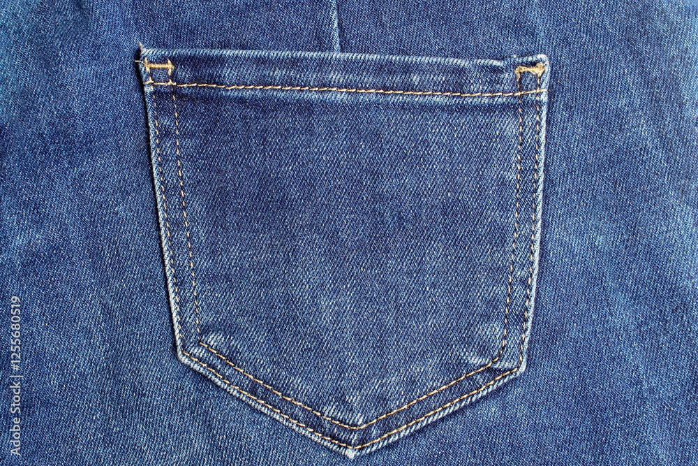 Background made from a denim pocket stitched with threads. Background made from a denim pocket stitched with threads.