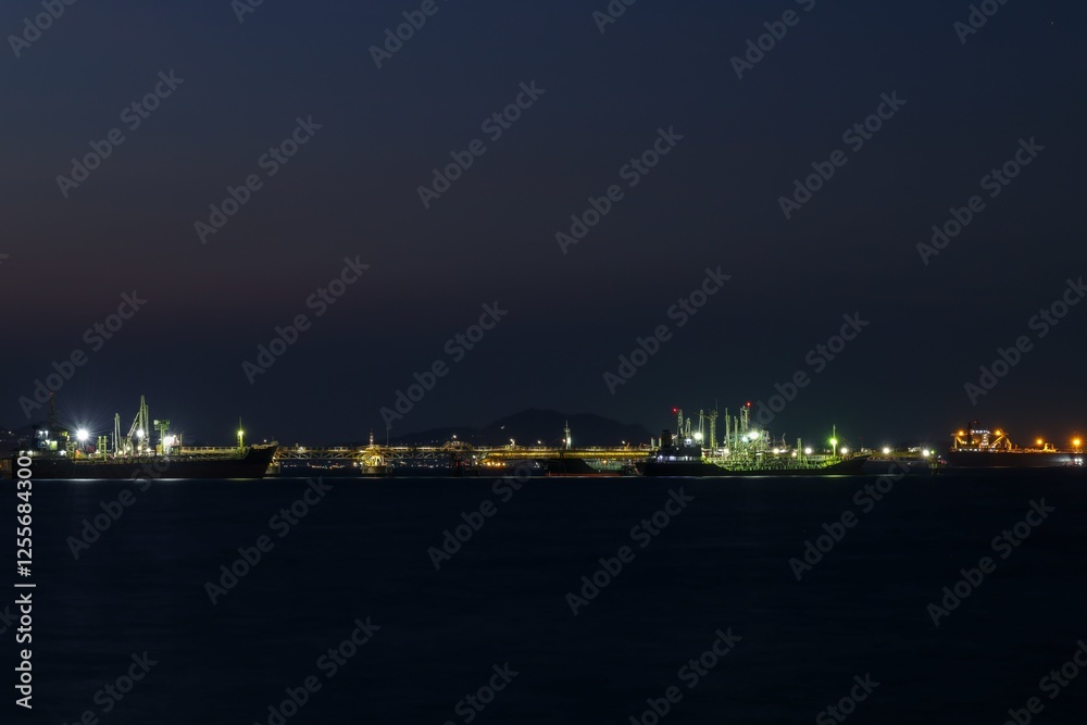 Seascape at night over lighting, crude oil floating station and bridge pipeline load and unloading oil and gas import export transportation global business, Seascape at night over lighting, crude oil floating station and bridge pipeline load and unloading oil and gas import export transportation global business,