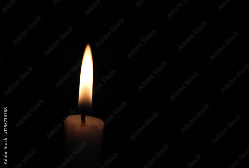 Close-up of a candle in the dark Close-up of a candle in the dark
