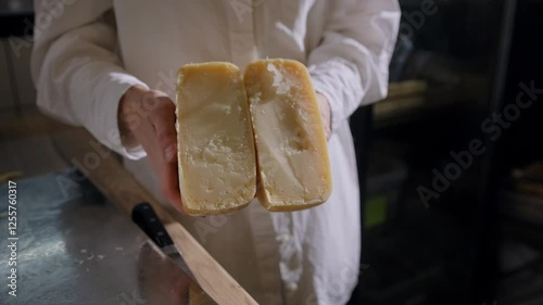 Large pieces of hard cheeses in close-up. Delicious cut of aged cheese in the sun. Cheese texture, tasting of the most delicious types of cheese, natural product.