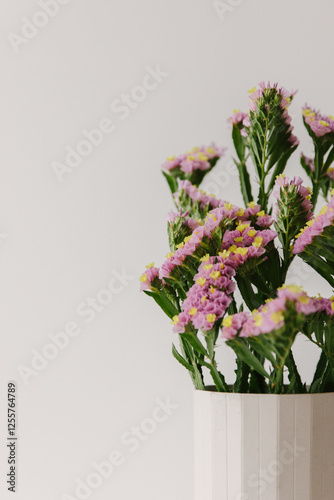 Close up of pink common sea lavender in a vase.