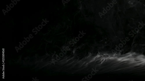 Closeup view motion of abstract white fog, smoke, and steam plumes flowing on a dark background