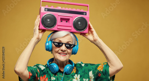 Stylish elderly woman holding a pink boombox, showcasing her vibrant personality