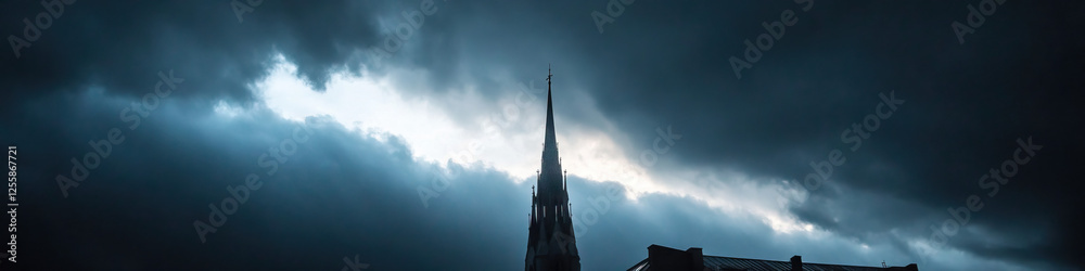 Fototapeta premium Church Steeple Silhouette Against Storm Clouds