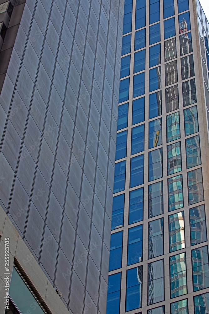 Close up of modern glass facade reflecting blue sky in Frankfurt Close up of modern glass facade reflecting blue sky in Frankfurt