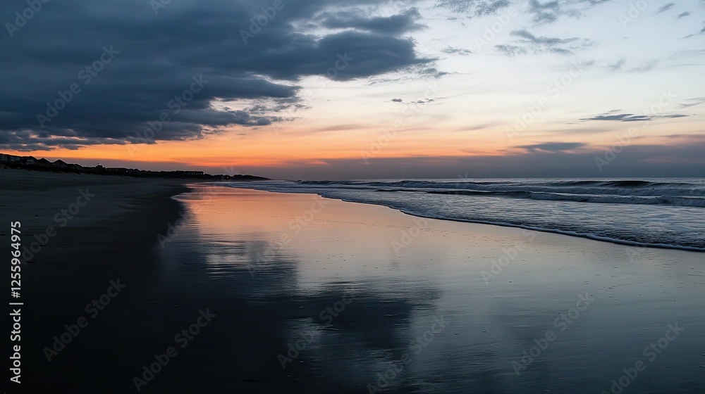 Ocean waves softly lapping against a sandy beach, under a colorful sunset sky Ocean waves softly lapping against a sandy beach, under a colorful sunset sky