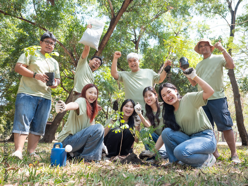 A group of volunteers 8 people is preparing to plant saplings in the urban forest. Volunteers are doing tree planting activities. Green earth concept.