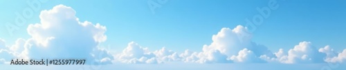 Soft white clouds drift lazily across the blue sky, white, horizon