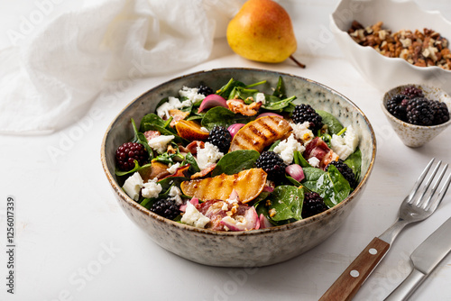 Grilled pear salad, Fresh salad with pears, spinach, cheese, walnuts, blackberries and dressing